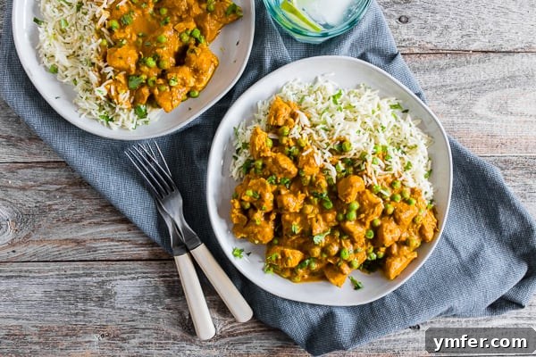Restaurant-Quality Instant Pot Chicken Tikka Masala 6 Instant Pot Chicken Tikka Masala on a plate, garnished with fresh cilantro.