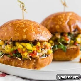These chipotle chicken burgers are topped with fiery pepper jack cheese and fresh homemade mango salsa. Trust me, this burger is packed full of flavor and the perfect addition to your summer BBQ.