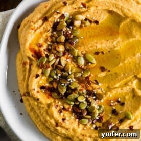 close up of toppings of pumpkin hummus
