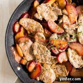 Plum-Glazed Pork Tenderloin Skillet 6 pork with plums in a skillet shot from overhead