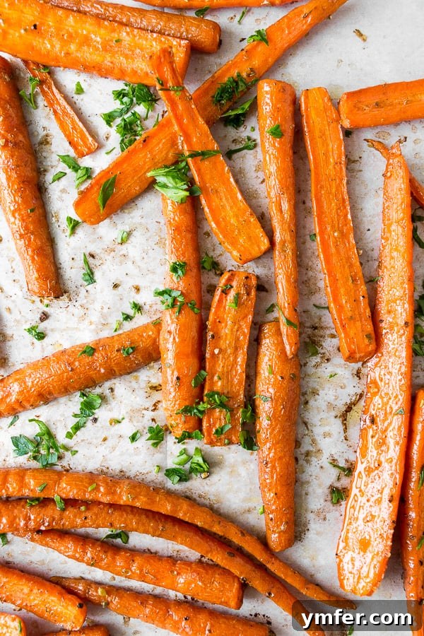 Golden Roasted Carrots, Effortlessly Delicious 2 overhead shot of the best easy roasted carrots, beautifully spiced and ready to serve