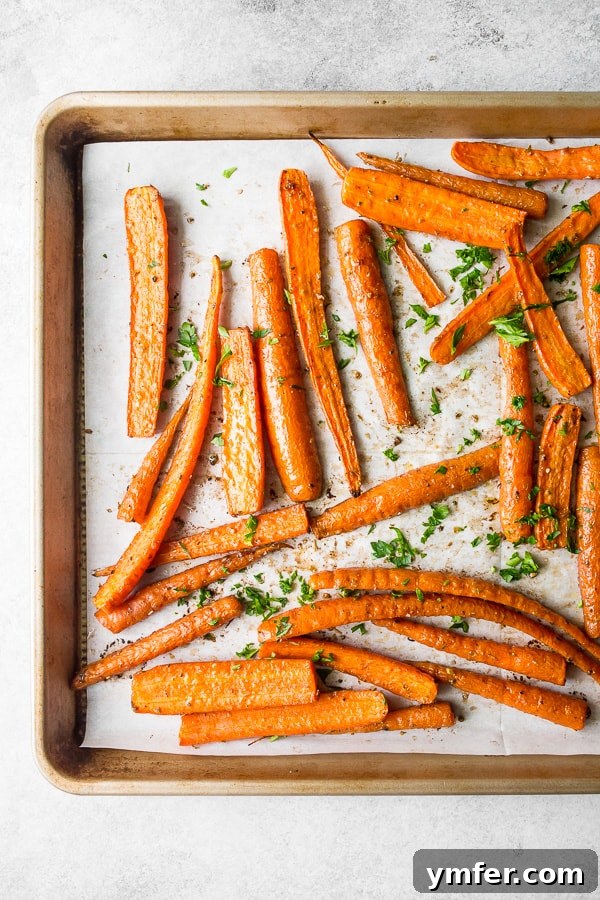 Golden Roasted Carrots, Effortlessly Delicious 4 best easy roasted carrots in a bowl, ready to serve, with a close-up on the spices