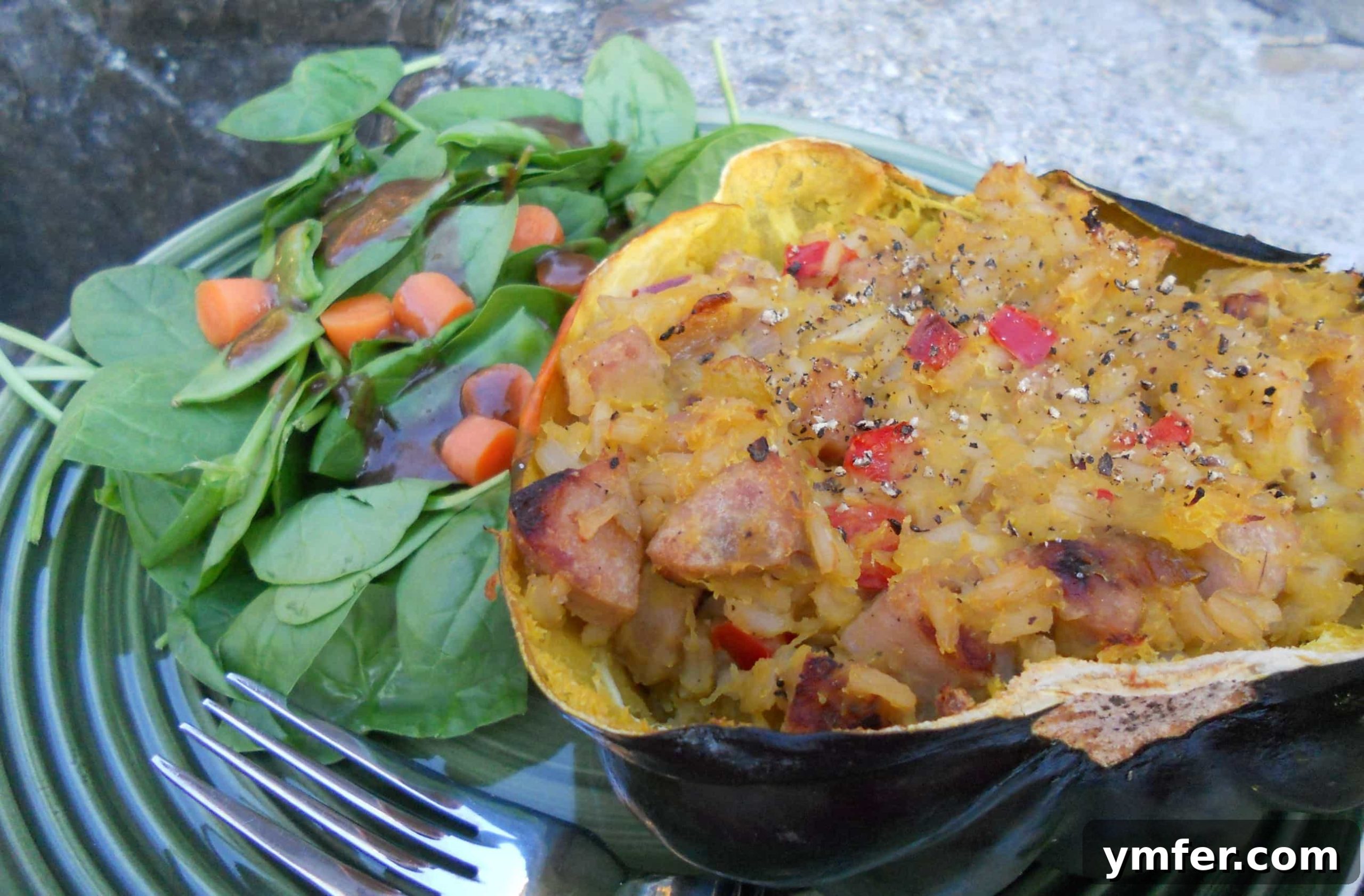 Chicken Sausage and Brown Rice Stuffed Acorn Squash Delicious chicken sausage and brown rice stuffed acorn squash, ready to be served for a cozy fall meal.