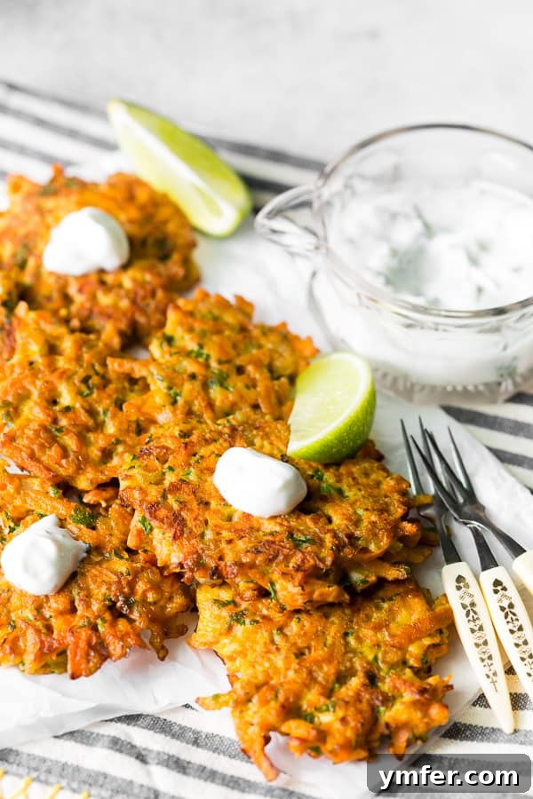 Golden Carrot Bites 2 Easy carrot fritters topped with creamy Greek yogurt sauce, ready to be served.