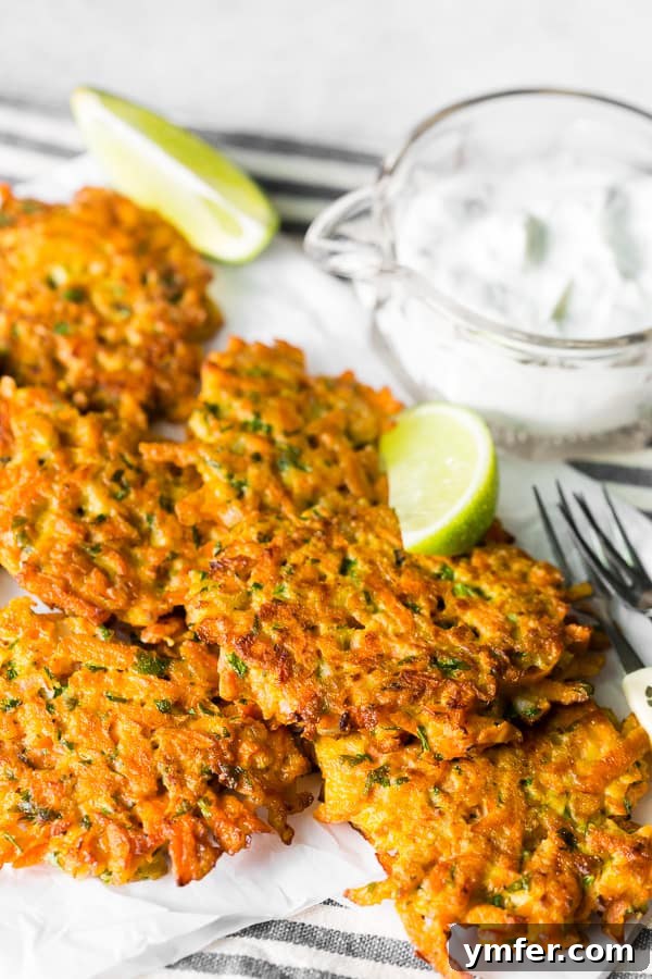 Golden Carrot Bites 4 Pile of golden-brown carrot fritters without the dipping sauce, showcasing their crispy texture.