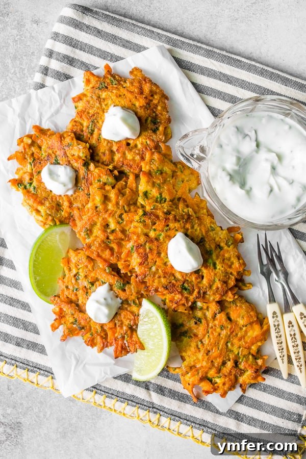 Golden Carrot Bites 5 Overhead shot of easy carrot fritters arranged beautifully, some with sauce, some plain.