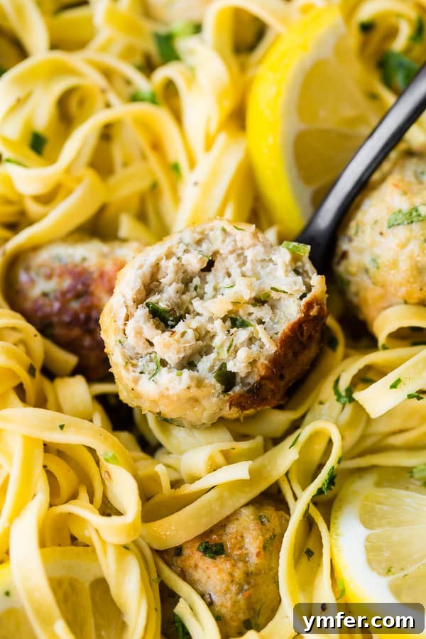 Zesty Baked Chicken Francese Meatballs 3 Baked Chicken Francese Meatballs cut in half, showing tender interior
