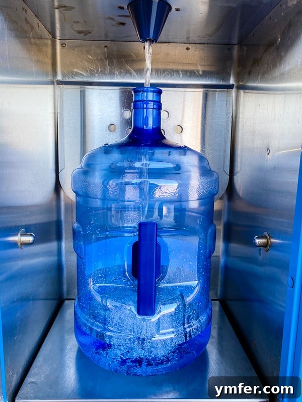 5 Easy Hacks to Boost Your Water Intake 7 A modern Primo water dispenser with a pet station at the bottom, offering purified water for both humans and pets.