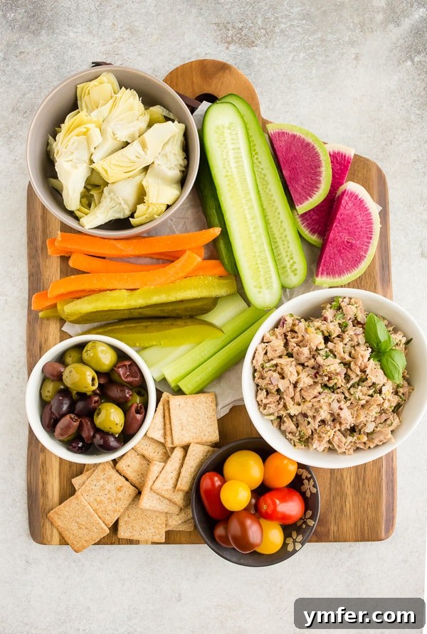 Zesty Tuna & Herb Grazing Board 3 lemon herb tuna salad snack board filled with fresh vegetables and olives