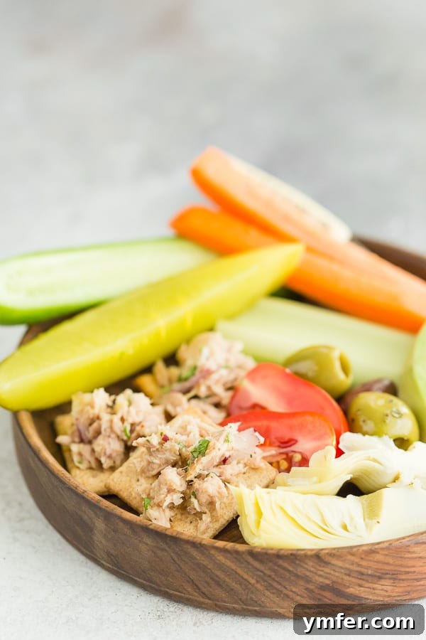 Zesty Tuna & Herb Grazing Board 5 lemon herb tuna salad on crackers on a plate