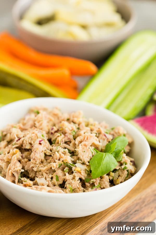 Zesty Tuna & Herb Grazing Board 7 lemon herb tuna salad in a small white bowl with veggies in the background