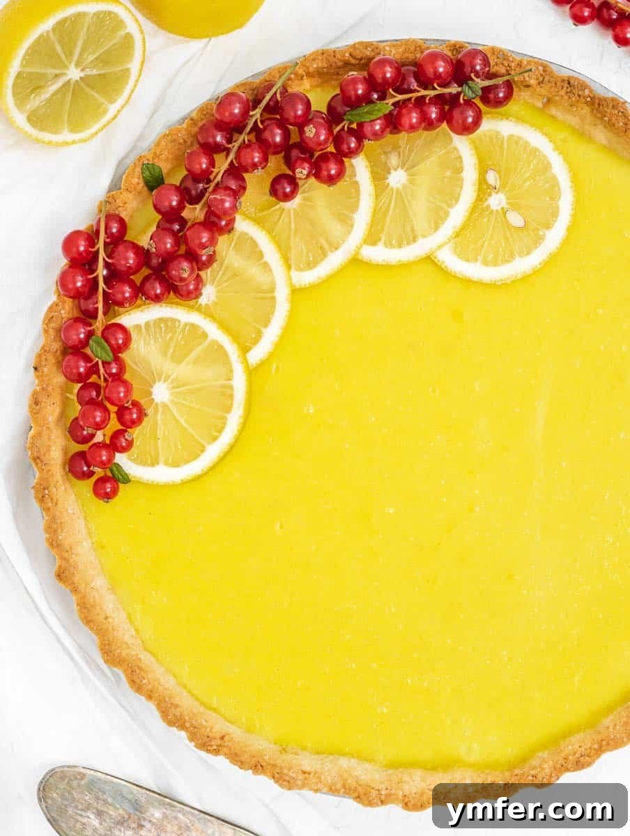 Luscious Vegan Lemon Tart 2 Lemon tart with lemon slices and berries