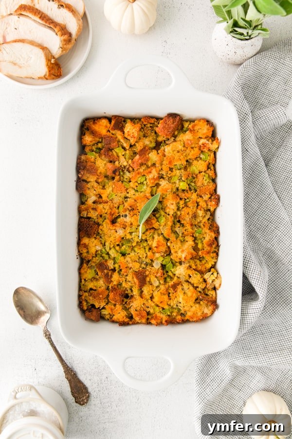 Savory Sage and Cornbread Stuffing 2 Golden brown Sage and Cornbread Stuffing in a white casserole dish, ready to be served.