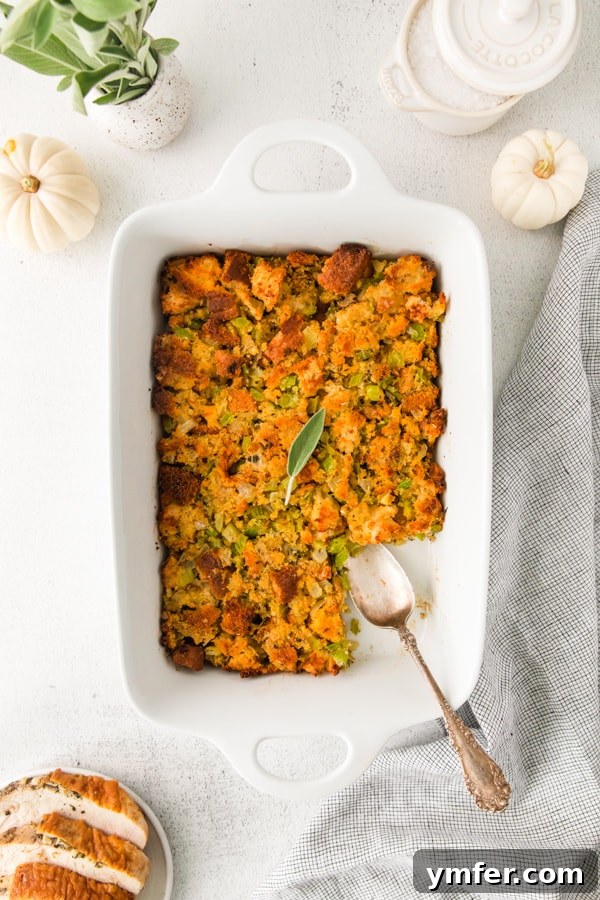 Savory Sage and Cornbread Stuffing 5 A large scoop of Sage and Cornbread Stuffing removed from the dish, showing its delicious texture.