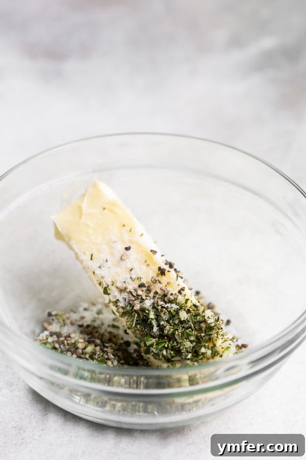 garlic herb compound butter ingredients in a bowl