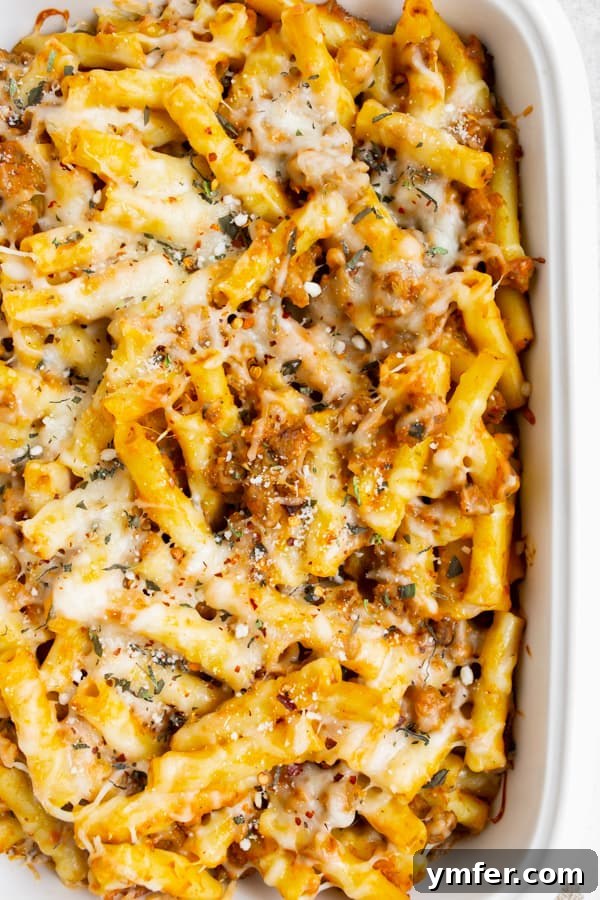 Velvety Pumpkin Ziti Gratin 2 Creamy Pumpkin Baked Ziti in a white casserole dish