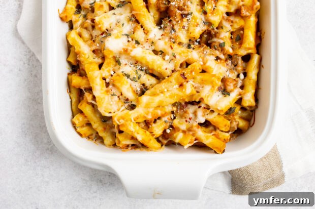 Velvety Pumpkin Ziti Gratin 5 creamy pumpkin baked ziti on a white background