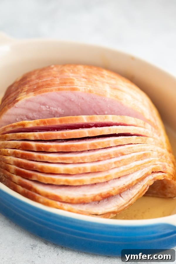 Honey Mustard Glazed Spiral Ham 4 A close-up view of an unbaked spiral ham ready in a baking dish, awaiting its delicious glaze.