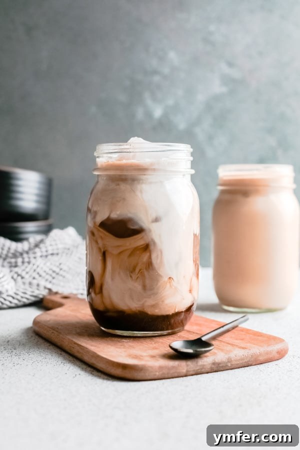 Golden Brown Sugar Shaken Espresso 2 Homemade Iced Brown Sugar Oat Milk Shaken Espresso in a glass, ready to be enjoyed.