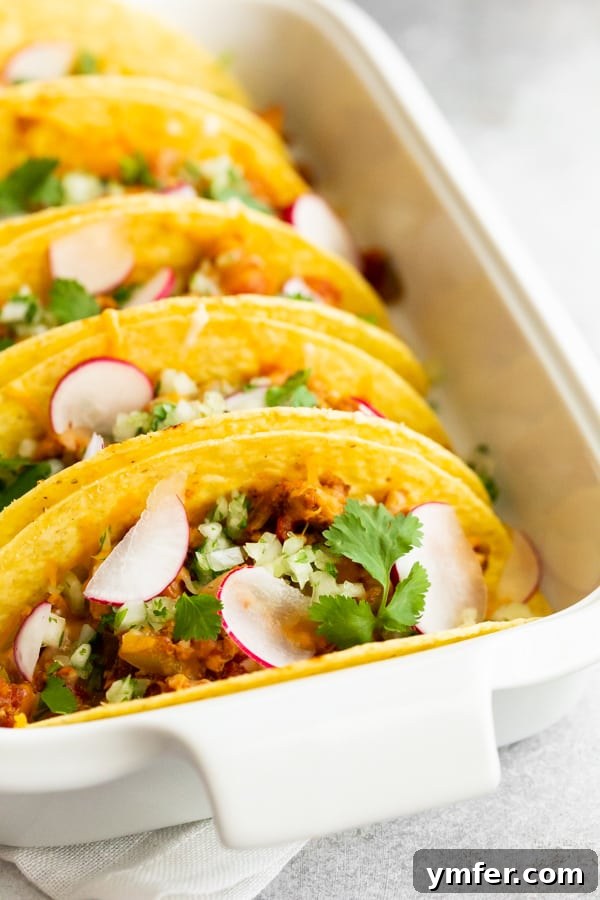 Golden Baked Ground Chicken Tacos 5 Arrangement of baked ground chicken tacos ready for toppings