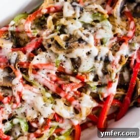 This lightly smothered chicken is smothered with honey mustard, onions, peppers, mushrooms and just a little cheese. Perfect for your healthy diet but still packed with delicious flavor!