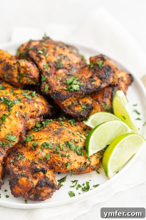 Bright Cilantro Lime Grilled Chicken Thighs 4 Grilled Cilantro Lime Chicken Thighs served with extra lime slices.