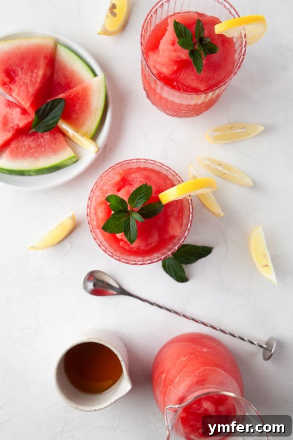 A vibrant Watermelon Frosé served in an elegant glass, garnished with fresh watermelon slices, ready for enjoyment.