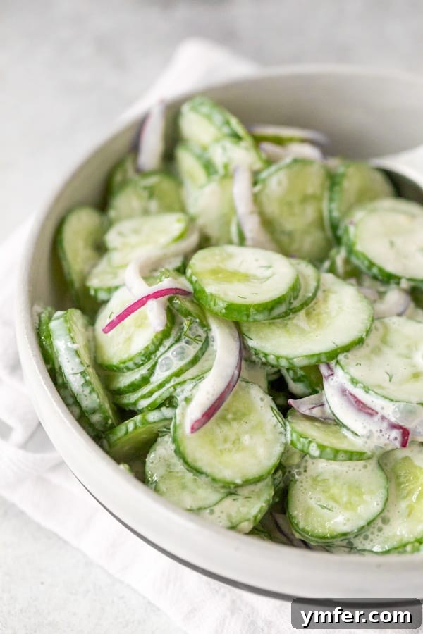 Cool Cucumber Salad with Creamy Horseradish 4 creamy horseradish cucumber salad served in a bowl sitting on a napkin.