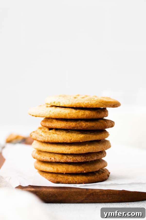 Ultimate Brown Butter Peanut Butter Cookies 3 A stack of golden-brown Brown Butter Peanut Butter Cookies arranged beautifully on a serving platter, ready to be enjoyed.