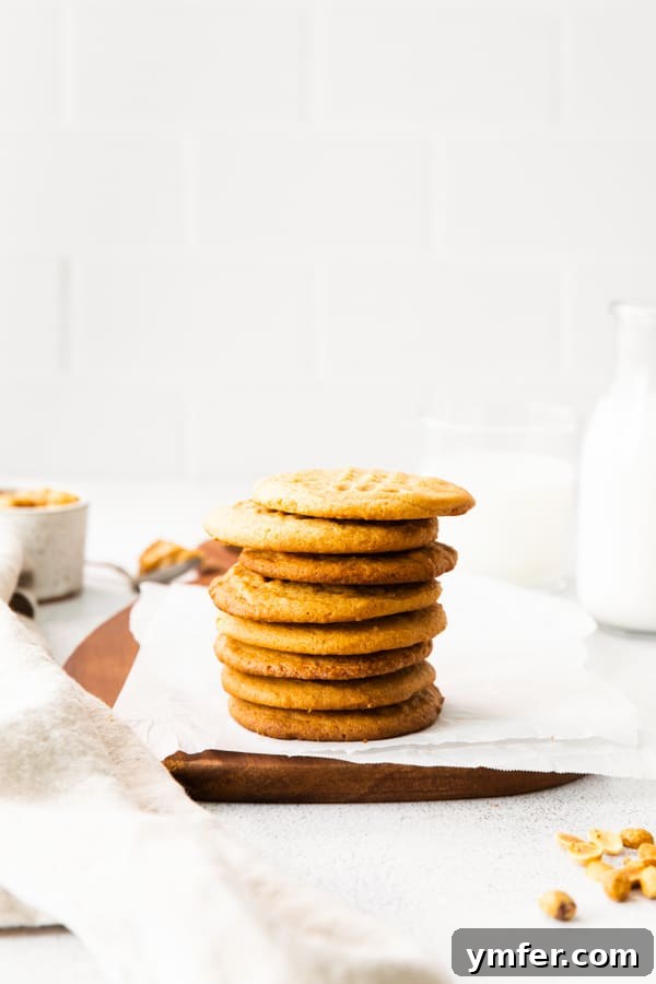 Ultimate Brown Butter Peanut Butter Cookies 6 A perfectly arranged stack of three Brown Butter Peanut Butter Cookies, showing off their golden texture and enticing appearance.