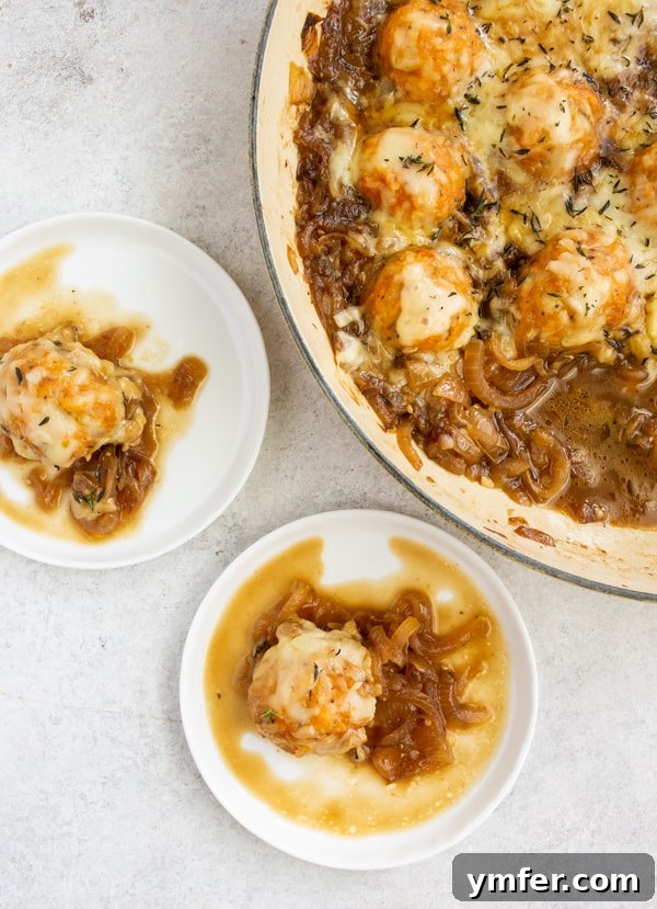 French Onion Chicken Meatballs served on small appetizer sized plates, showcasing the rich sauce and melted cheese. A perfect bite-sized delight.