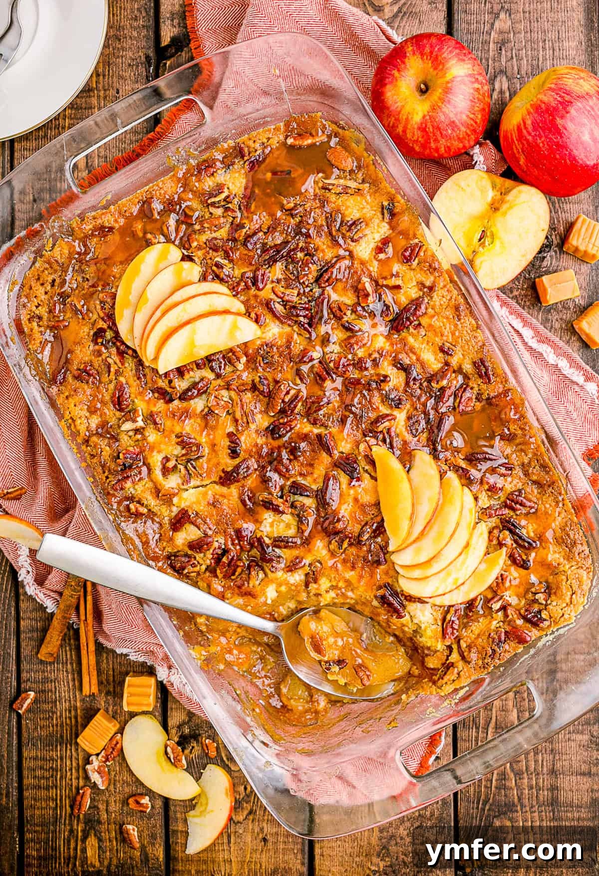 Golden Caramel Apple Bake 2 A 9x13 pan of golden brown Caramel Apple Dump Cake, fresh from the oven and ready to be served.