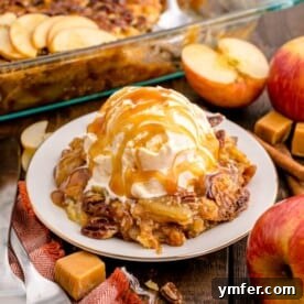A delicious Caramel Apple Dump Cake, freshly baked in a pan, with its golden-brown topping and rich, bubbly filling.