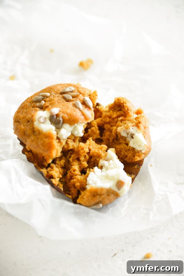 Heavenly Pumpkin Cream Cheese Swirls 3 Pumpkin Cream Cheese Muffins cut in half.