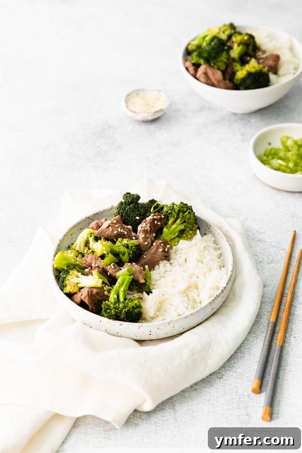 Crispy Air Fryer Beef and Broccoli 4 Air Fryer Beef and Broccoli sprinkled with sesame seeds.