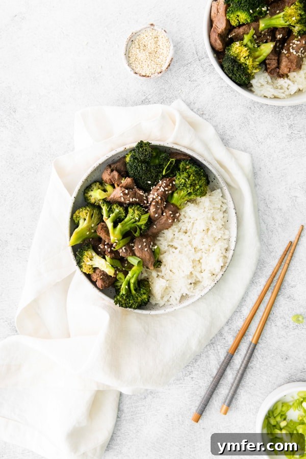 Crispy Air Fryer Beef and Broccoli 5 Air Fryer Beef and Broccoli served with white rice.