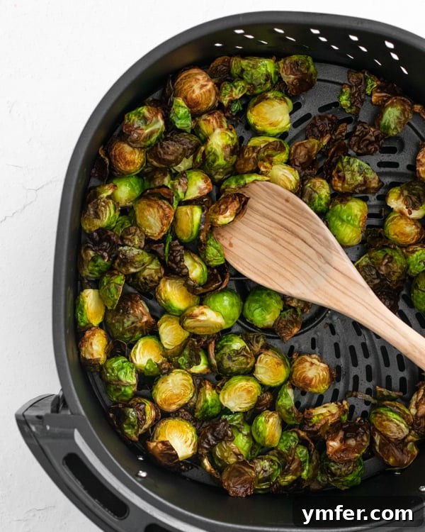 Crispy Air Fryer Brussels Sprouts 6 Air Fryer Brussels Sprouts sitting in the air fryer basket.