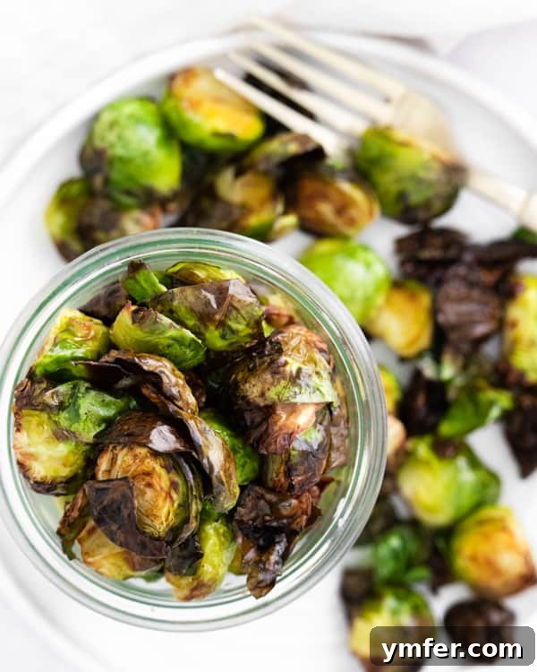 Crispy Air Fryer Brussels Sprouts 7 Air Fryer Brussels Sprouts served on a plate.