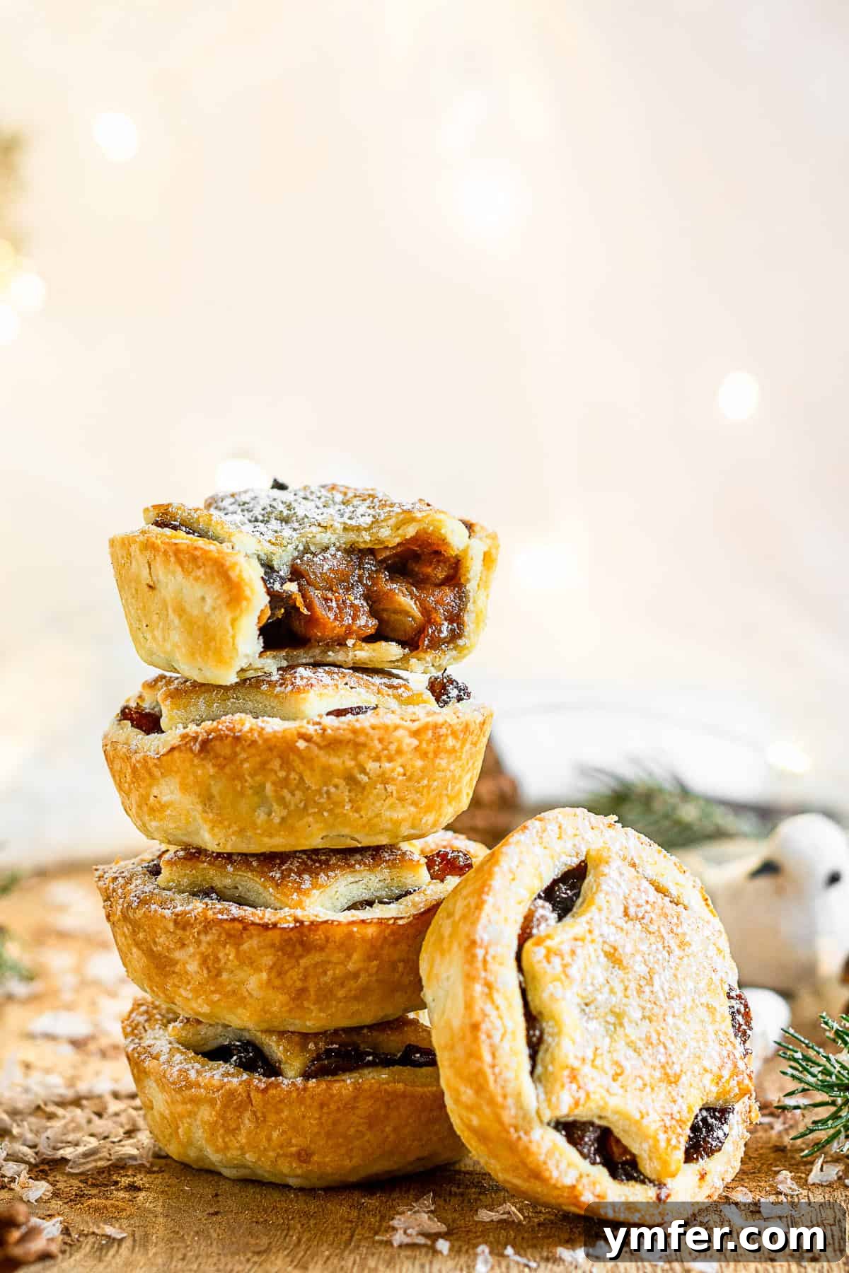 Spiced Holiday Mini Tarts 5 Mini Mincemeat Pies stacked on top of each other.