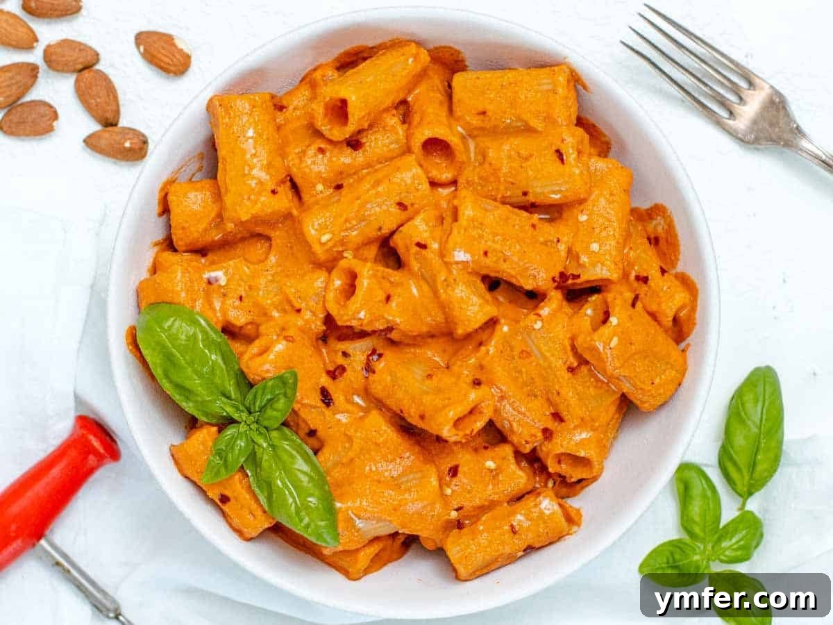 Plant-Powered Pasta 14 Red Pepper Pasta with fresh basil leaves
