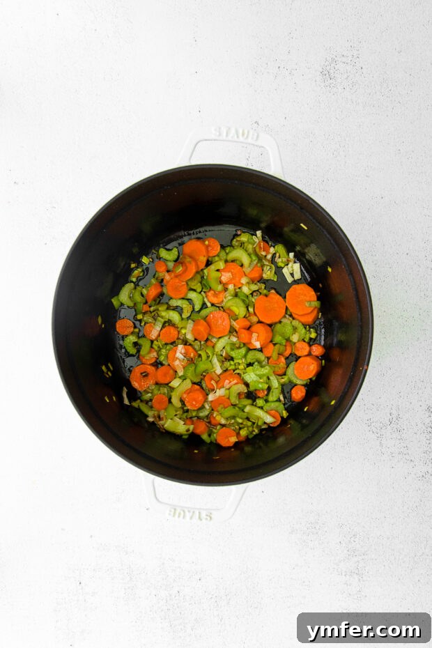 Nourishing French Lentil Potage 4 Vegetables sautéed in a soup pot.
