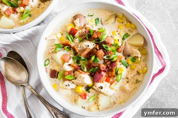 Homestyle Chicken Corn Chowder 4 A bowl of creamy Chicken Corn Chowder garnished with crispy bacon bits, ready for serving.