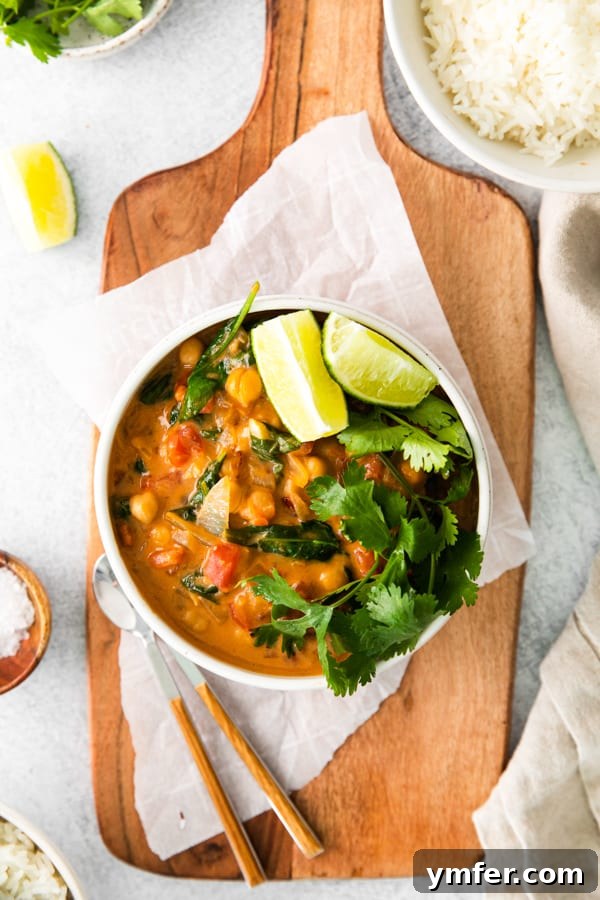 Hearty Vegan Chickpea Curry 2 A delicious bowl of Vegan Chickpea Curry, garnished with fresh herbs and ready to be enjoyed.