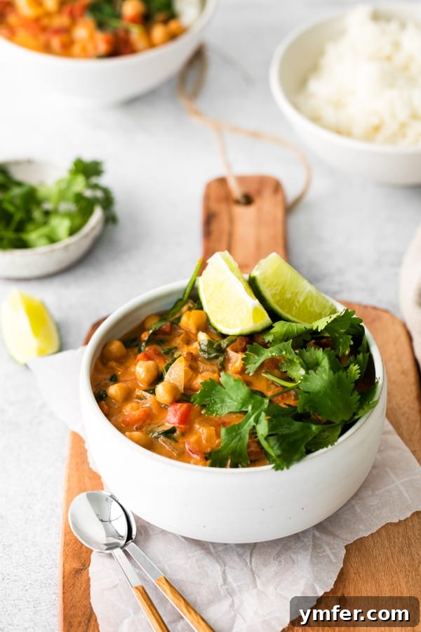 Hearty Vegan Chickpea Curry 5 Vegan Chickpea Curry served with fresh cilantro on top.