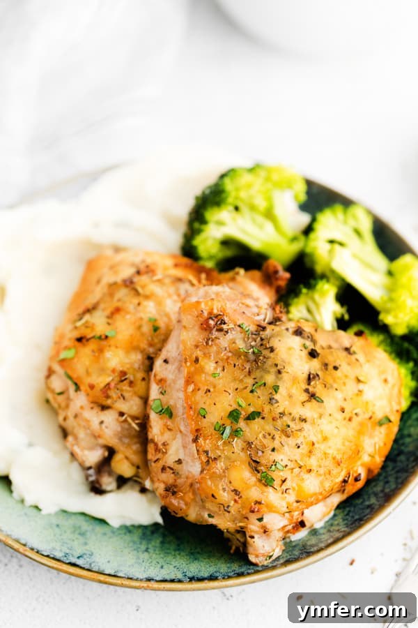 Ultimate Air Fryer Chicken Thighs 9 Air Fryer Chicken Thighs on a ceramic plate.
