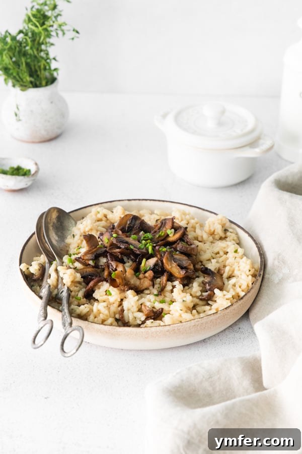 Earthy Wild Mushroom Risotto 3 Close-up of creamy wild mushroom risotto in a serving bowl, ready to be enjoyed.