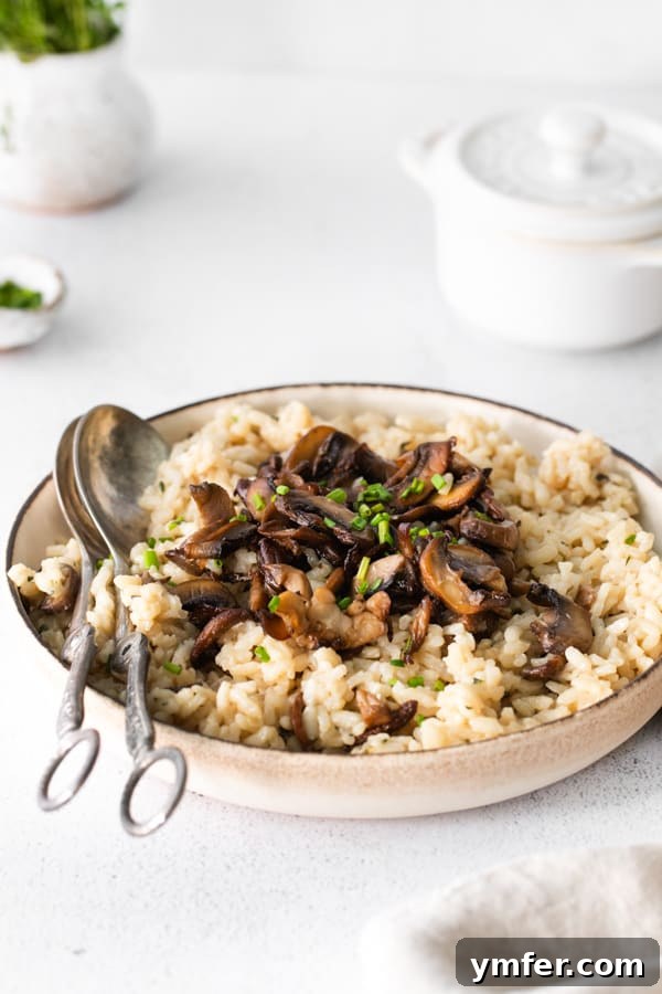 Earthy Wild Mushroom Risotto 5 A pristine white bowl filled with creamy wild mushroom risotto, artfully presented.
