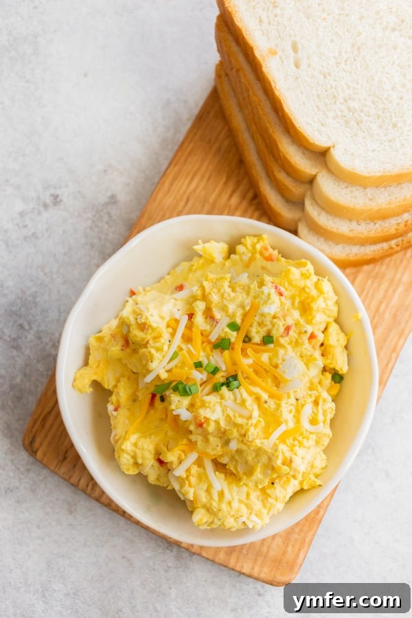 Creamy Pimento and Cheddar Egg Salad 4 Pimento Cheese Egg Salad in a bowl.
