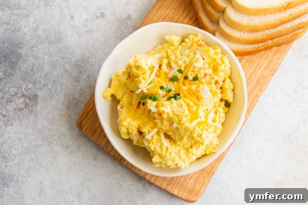 Creamy Pimento and Cheddar Egg Salad 7 Pimento Cheese Egg Salad in a white bowl.