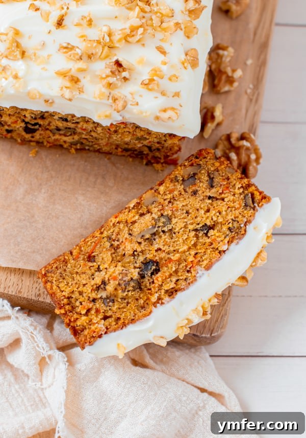 Spiced Carrot Loaf 6 Close-up of a Carrot Cake Loaf Cake, freshly sliced and ready to eat.